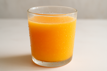 A cup of fresh squeezed orange juice
